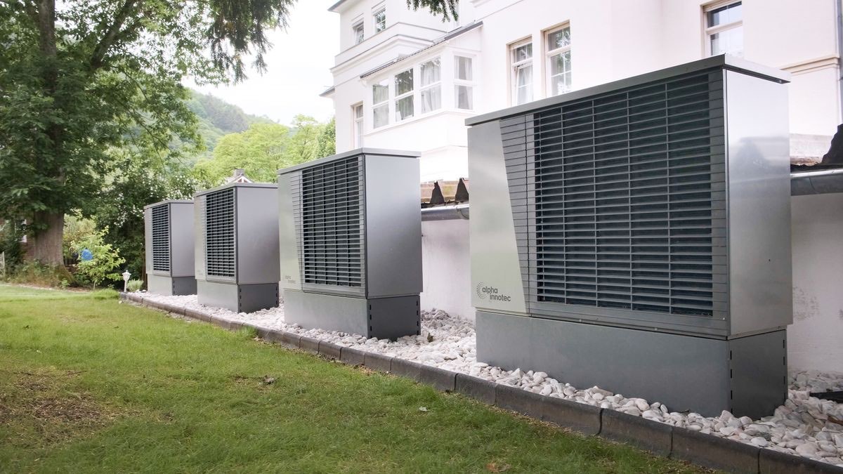 A neat row of heat pump units installed at a house